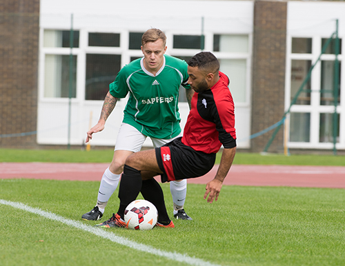 Army Units Champions League Cup Final 2017. The Army Football Association (Army FA) have conceived a new competition to identify the overall Army Units League Champions. The 2016/17 divisional champions of the Southern, Northern, Midlands and Scottish Leagues have all been involved on the route to the Final. The inaugural final was held at the Aldershot Military Stadium on Wednesday 6th September. Contesting this first Army Units Champions League Cup Final were the Ripon based 21 Engineer Regiment (21RE), and the Stafford based 1 Signal Regiment (1SR). After ninety minutes of end to end and entertaining football, it was 1 Signal Regiment who ran out worthy winners 3-2. Despite falling behind in the first half, they fought back to lead 2-1 at half time. A third goal for the Signallers' cemented their lead in the second half. However the Engineers pulled a goal back to ensure a frantic final few minutes in search of an equaliser that never came. Therefore it is the name of 1 Signal Regiment that goes on the trophy as the initial winners of this new competition. Photographer - Cpl Mark Webster (RLC Phot)